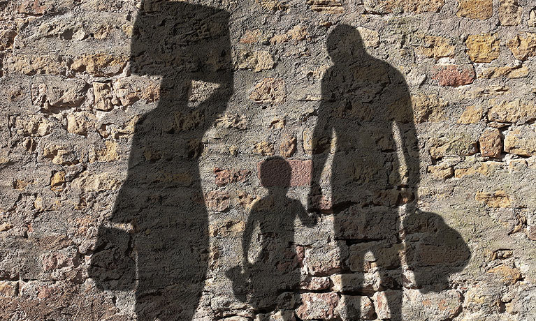 Shadows of refugees on wall