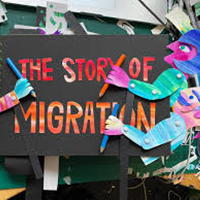 Clip art showing a book titled the story of migration