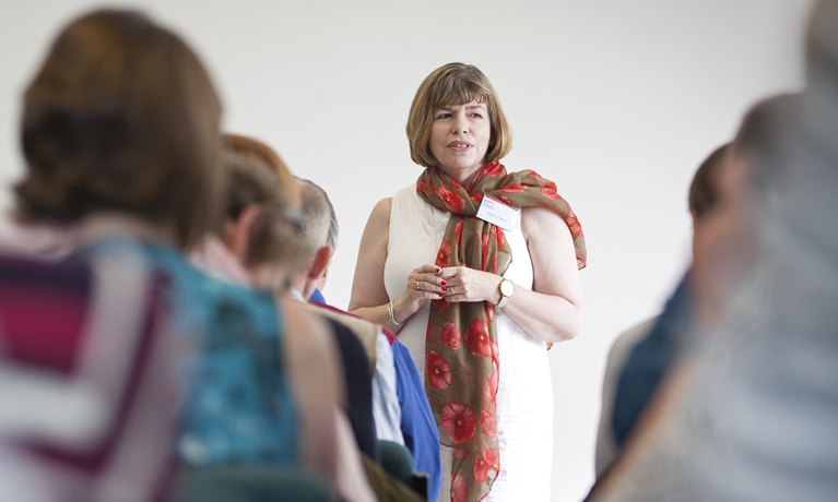 Megan Crawford presenting a seminar to a group of students