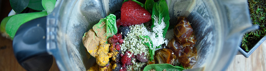 Colourful fruit and vegetables in a smoothie jug