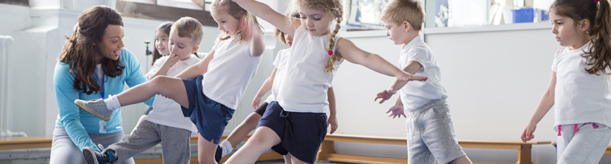 Schoolchildren balancing in a PE class