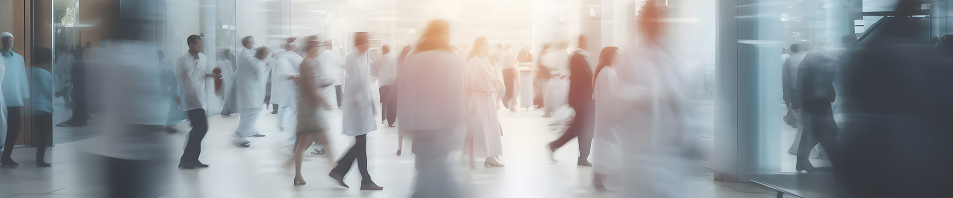 Motion blur of staff weating white coats in a hospital
