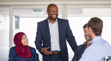 Group of professional people chatting a room