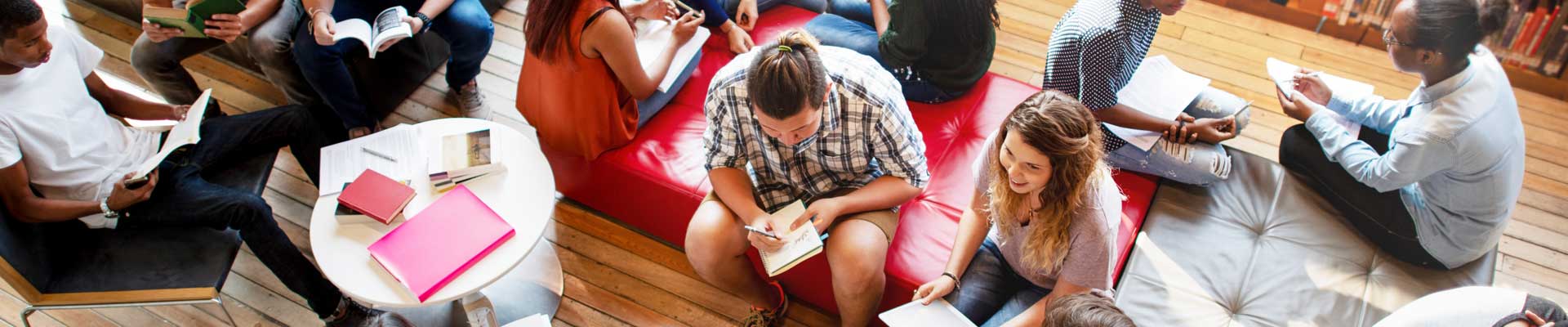overhead shot of a group of people reading and talking