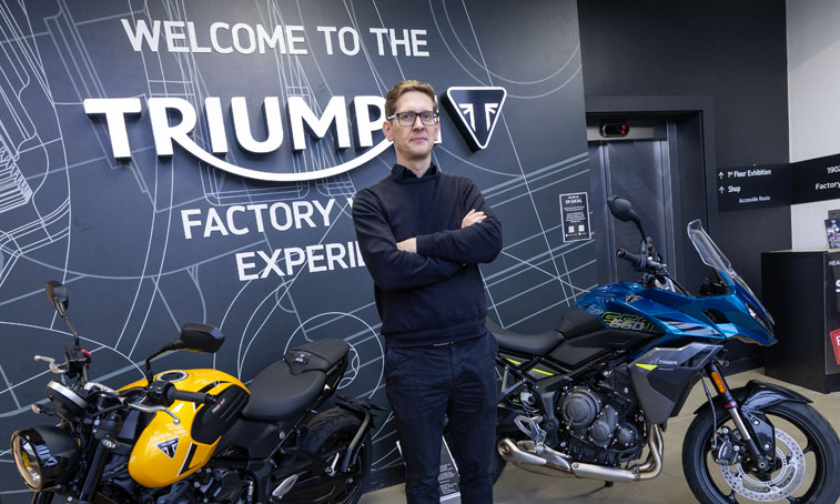 Gavin Hardman standing next to bikes