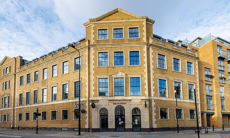 The exterior of the Hudson building on a clear day