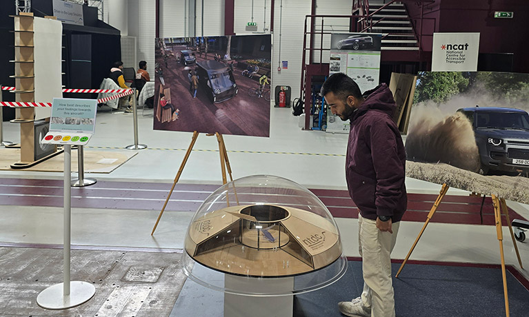 Adarsha Adhikar looking at a piece of work in a musuem