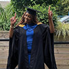 Phoebe Lewin stood in her graduation gown and hat smiling