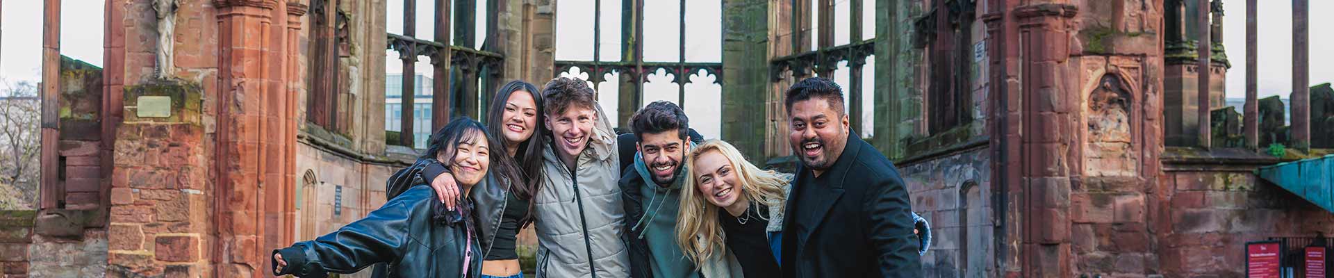 Group of students standing in the Cathedral ruins