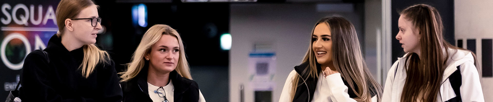 A group of students walking out of Coventry University's entertainment venue Square One.