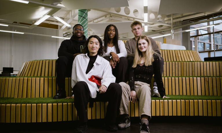 Group of students sitting in the hub 
