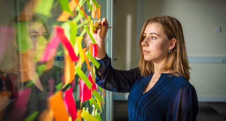 woman painting on glass