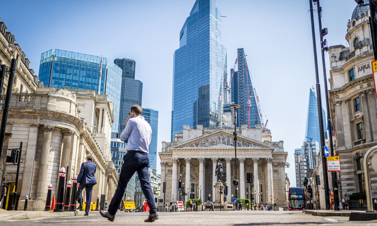 People walking through London's financial district.