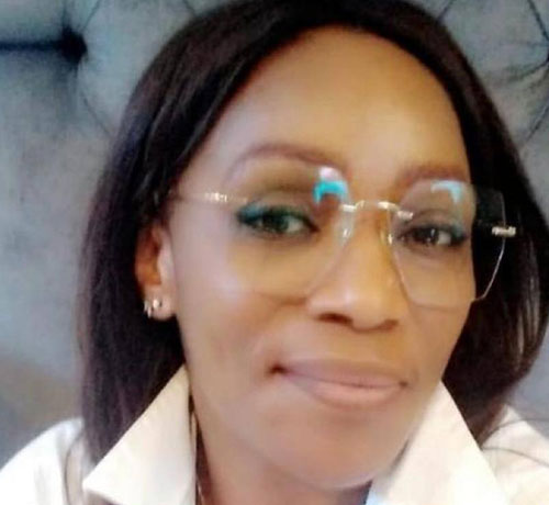 Vanessa Nnachi-Uche close up portrait of face wearing glasses and smiling