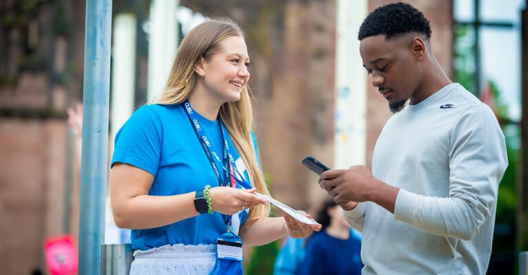 Student union rep chatting to a student