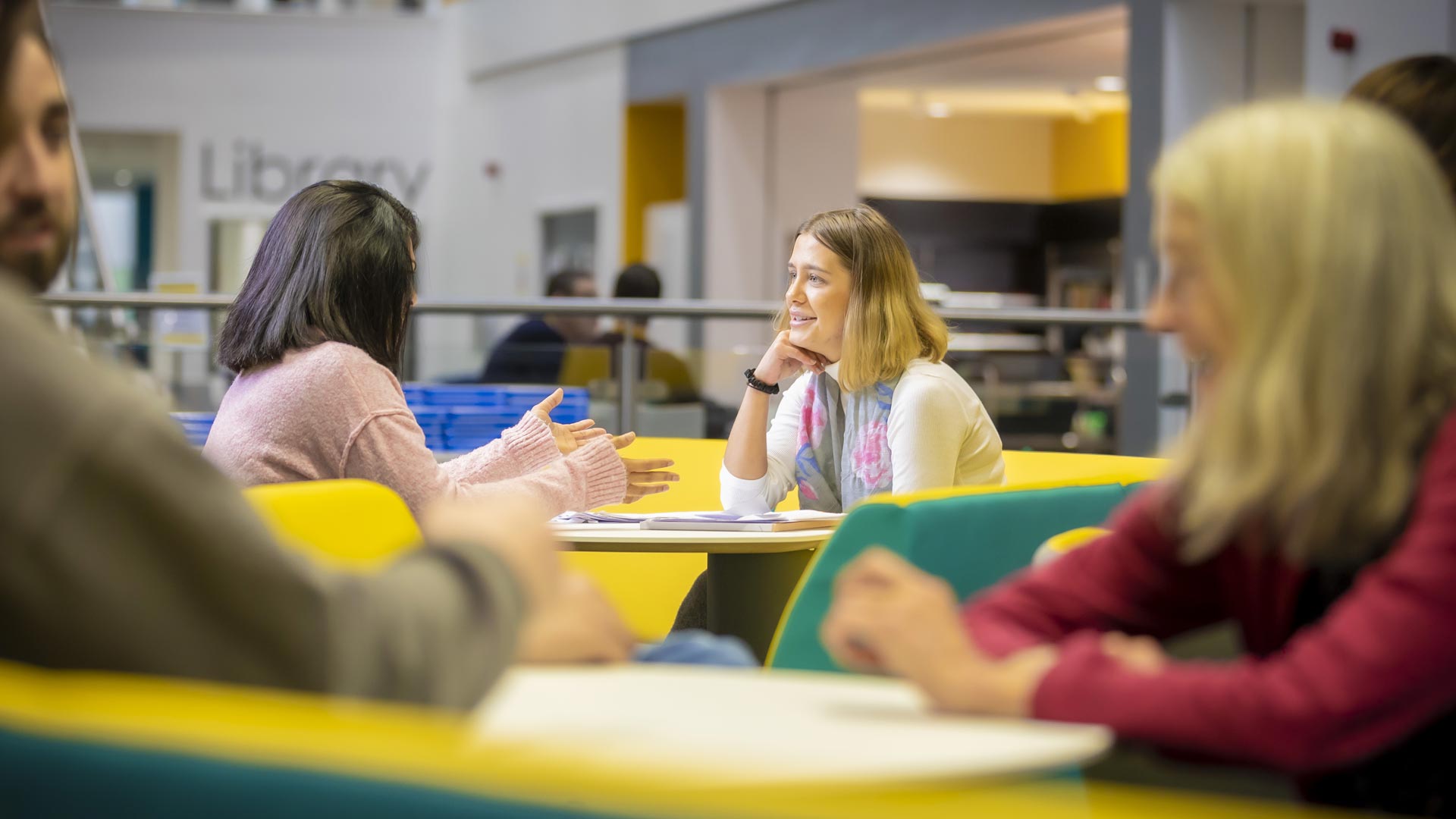 students chatting in a break out area 