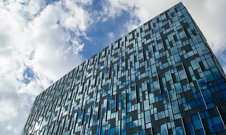 Outside of the Greenwich building with cladding on the side