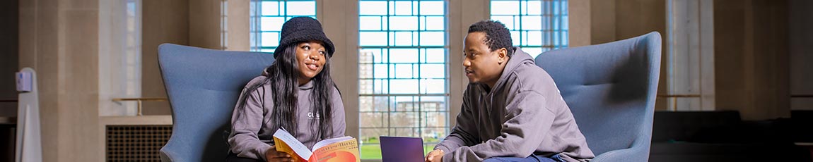 Two students sat down at a table talking