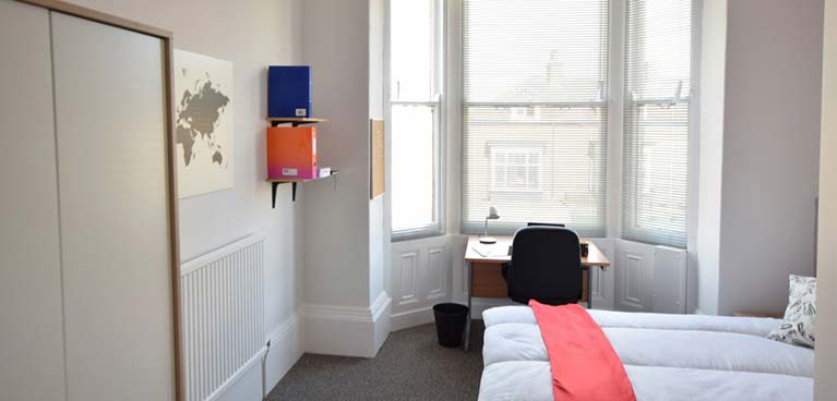 Bedroom in Aberdeen House with a desk in the bay window