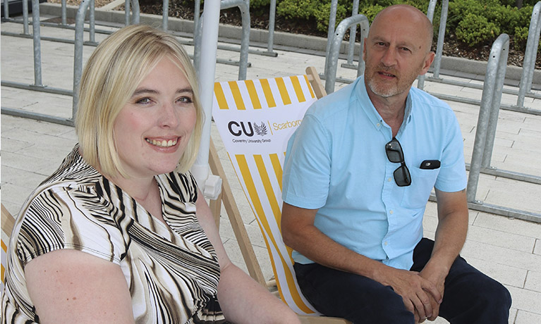 Rebecca and Roy sitting on deckchairs