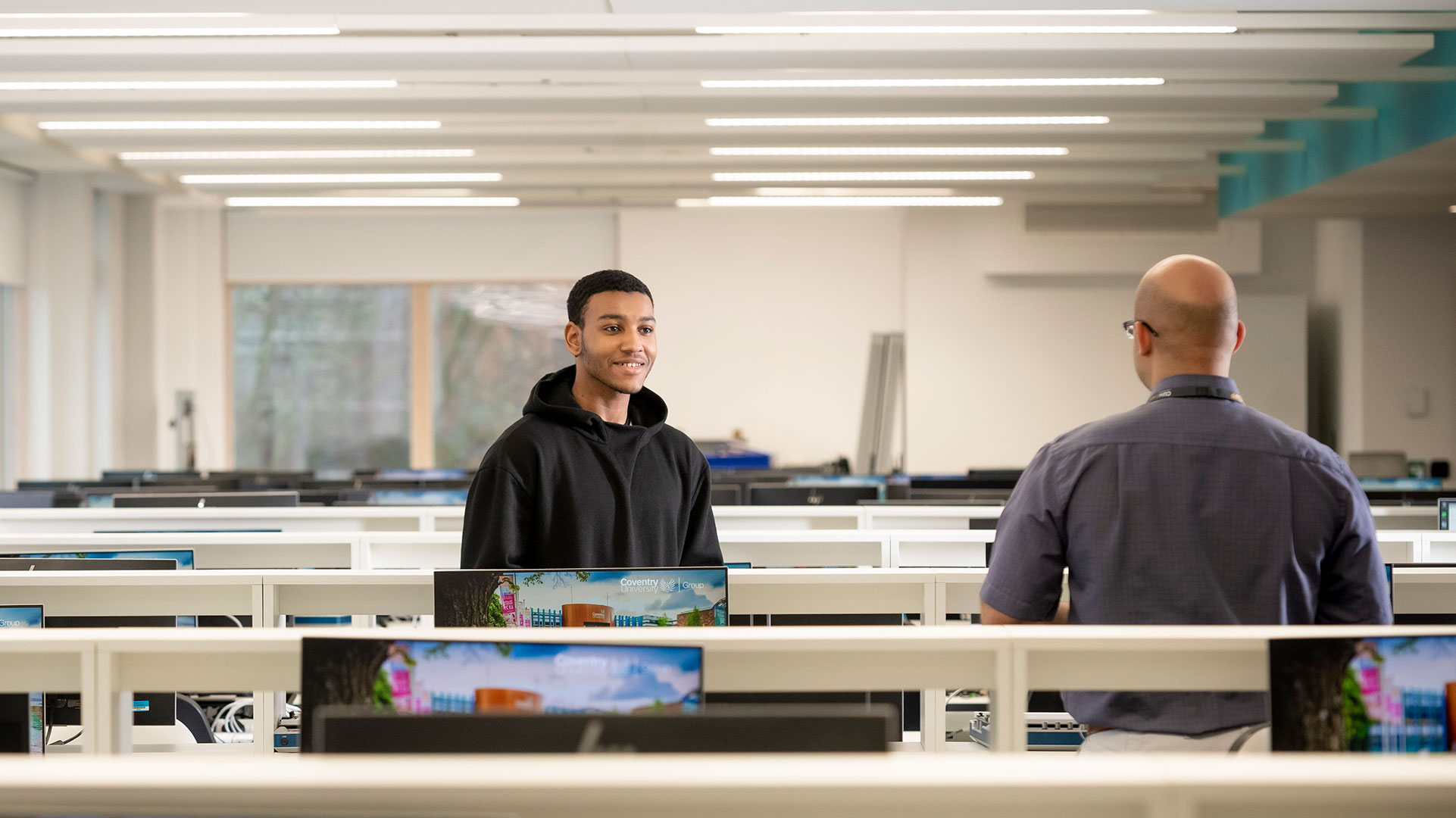 A student and tutor in the IT suite