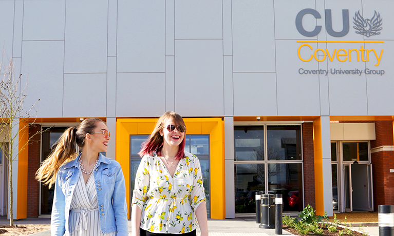 Students outside the new CU Coventry campus at Mile Lane