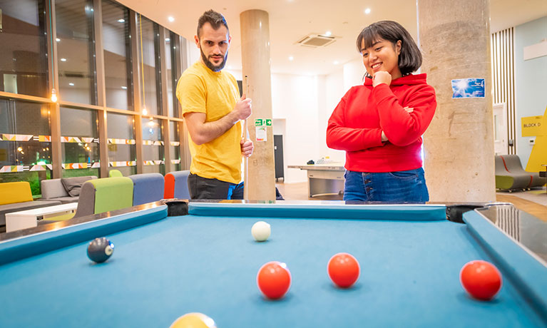 Students playing pool