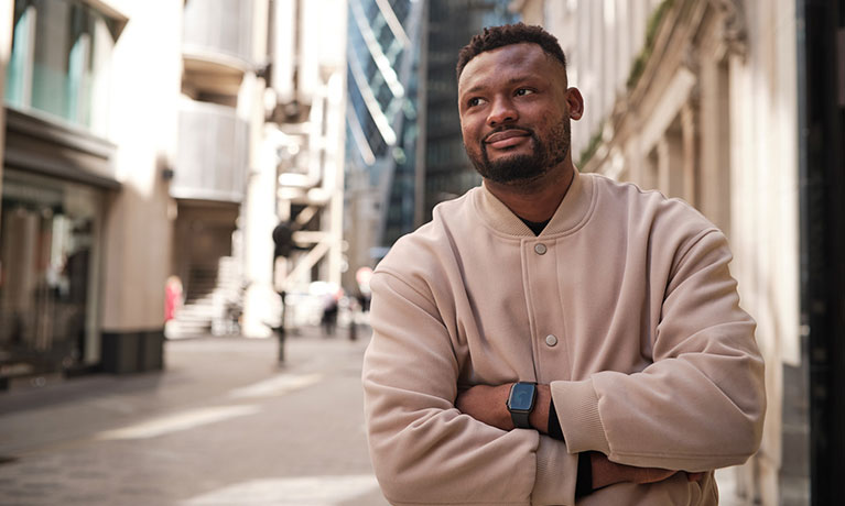 Emmanuel MBA student portrait down a street in London