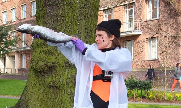 female holding a fish