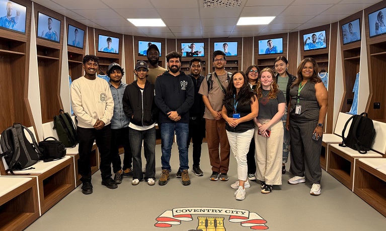 Students and tutors from Coventry University's Graphic Design MA course in the home dressing at Coventry City FC