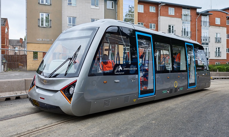 A tram outside of a building