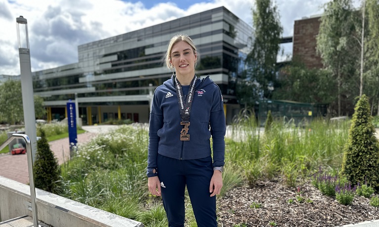 Emma Reid wearing her Great Britain tracksuit and World Championship bronze medal