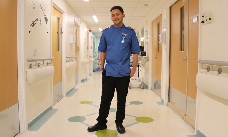 Dan smiling in a hospital corridor