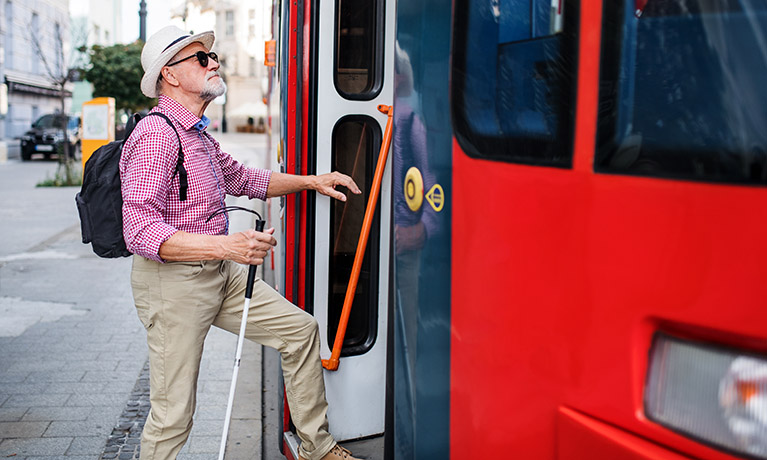 A picture of a man stepping onto a bus