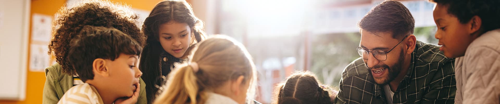 Group of schools kids having an art lesson with a teacher