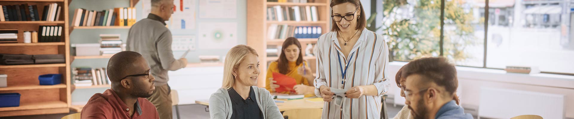 People working together in a classroom at a desk