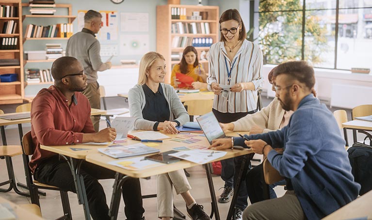 A group of teachers seated around a table