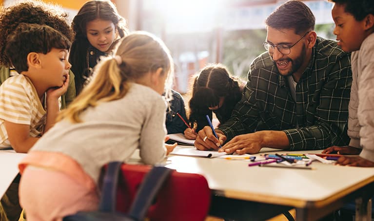 Group of schools kids having an art lesson with a teacher