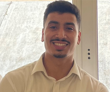 Headshot profile picture of Abdul Ghani Meshreghi, smiling at the camera.