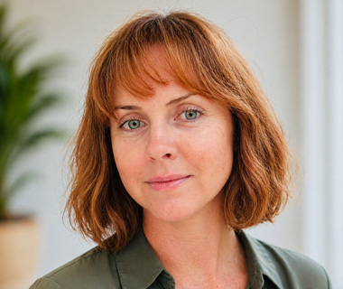 Headshot of Emma-Maria Robertson against a white background.