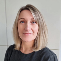 Headshot of Sonia Mathias smiling at the camera.