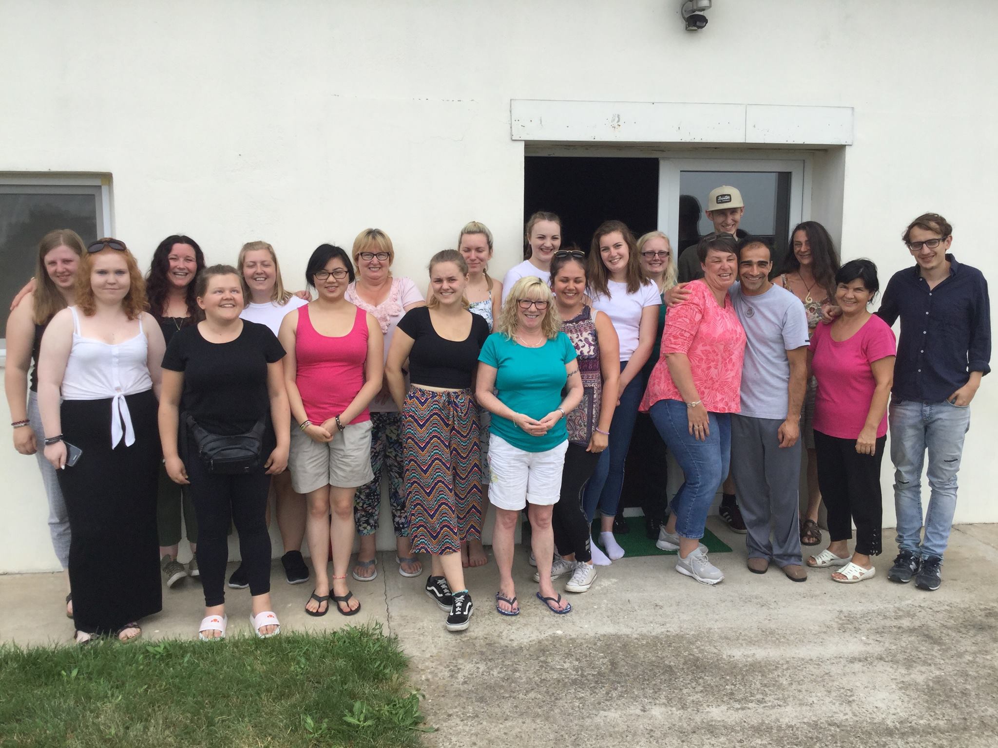 Students and staff from CU Scarborough stood together outside a building in Romania