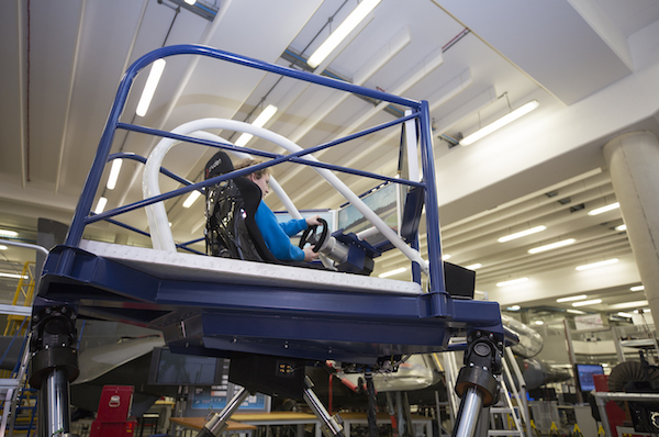 Maciej Sakowicz in the driving seat of Coventry University’s new Formula One simulator.