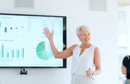 lecturer presenting graphs on a screen