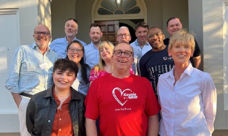 A group of people standing outside a building